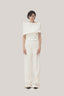 White Anh Vi Straight Asymmetric Sleeved Satin Top for women, from TINH, The Viet Concept 
