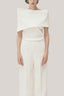 White Anh Vi Straight Asymmetric Sleeved Satin Top for women, from TINH, The Viet Concept 