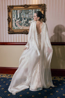 THÉSONG • Ivory Draped Cape Evening Gown
